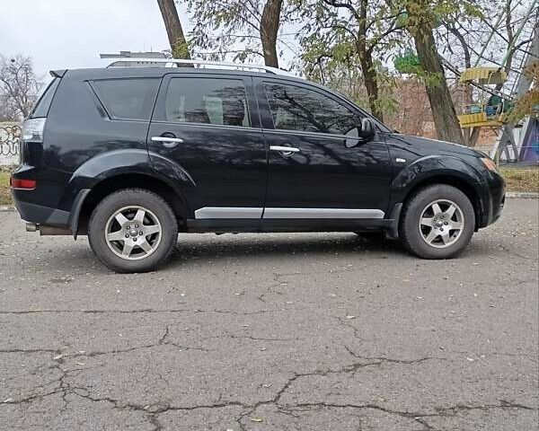 Чорний Міцубісі Аутлендер, об'ємом двигуна 2.36 л та пробігом 265 тис. км за 8800 $, фото 1 на Automoto.ua