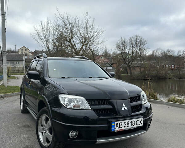 Чорний Міцубісі Аутлендер, об'ємом двигуна 2 л та пробігом 118 тис. км за 8100 $, фото 1 на Automoto.ua
