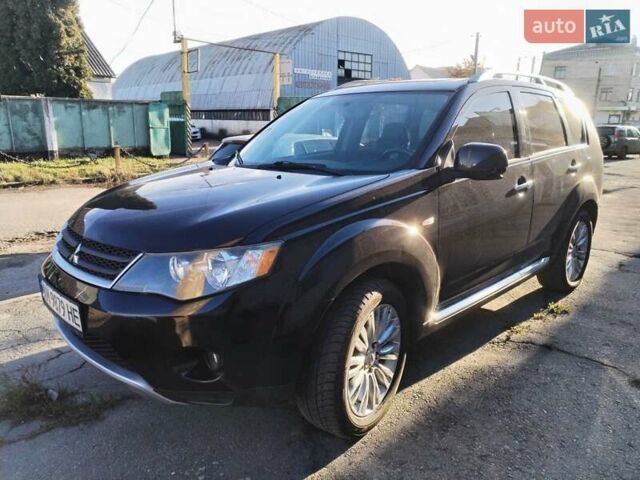 Черный Мицубиси Аутлендер, объемом двигателя 2.4 л и пробегом 199 тыс. км за 9000 $, фото 1 на Automoto.ua