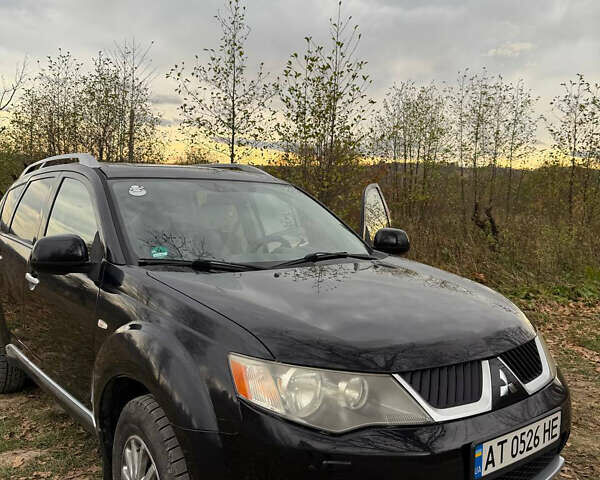 Черный Мицубиси Аутлендер, объемом двигателя 2.18 л и пробегом 233 тыс. км за 9600 $, фото 1 на Automoto.ua