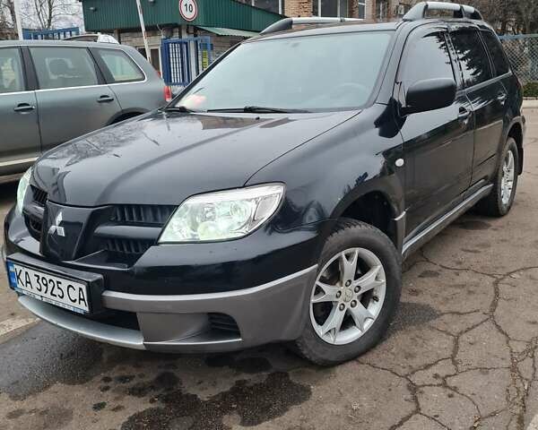 Черный Мицубиси Аутлендер, объемом двигателя 2 л и пробегом 212 тыс. км за 7900 $, фото 1 на Automoto.ua