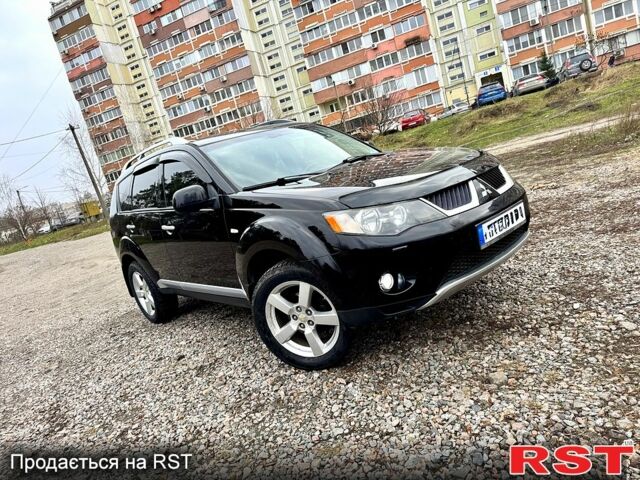 Черный Мицубиси Аутлендер, объемом двигателя 2.4 л и пробегом 229 тыс. км за 9790 $, фото 1 на Automoto.ua