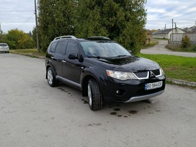 Черный Мицубиси Аутлендер, объемом двигателя 2.2 л и пробегом 200 тыс. км за 9500 $, фото 1 на Automoto.ua