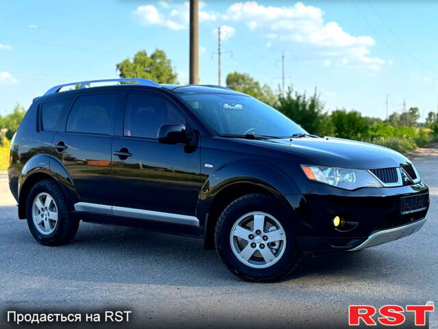 Чорний Міцубісі Аутлендер, об'ємом двигуна 2.4 л та пробігом 171 тис. км за 8999 $, фото 1 на Automoto.ua