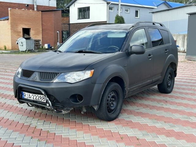 Черный Мицубиси Аутлендер, объемом двигателя 2 л и пробегом 285 тыс. км за 2950 $, фото 1 на Automoto.ua