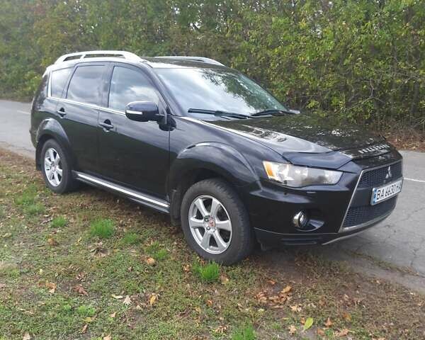 Чорний Міцубісі Аутлендер, об'ємом двигуна 2 л та пробігом 220 тис. км за 10700 $, фото 1 на Automoto.ua