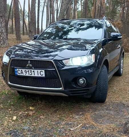 Черный Мицубиси Аутлендер, объемом двигателя 2.2 л и пробегом 267 тыс. км за 9999 $, фото 1 на Automoto.ua