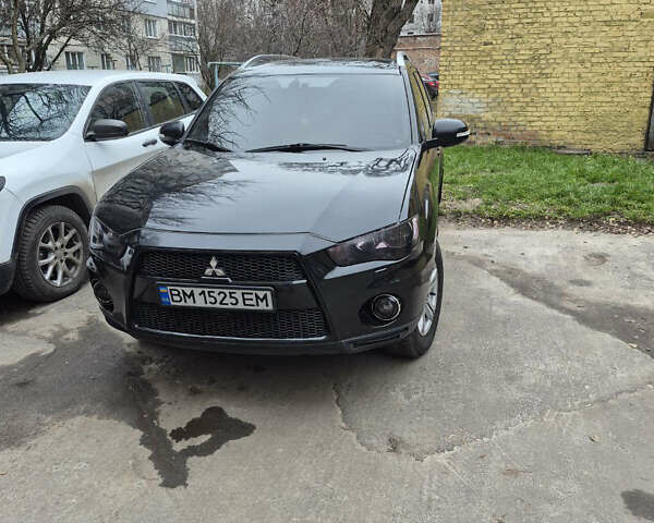 Черный Мицубиси Аутлендер, объемом двигателя 2.4 л и пробегом 198 тыс. км за 10500 $, фото 1 на Automoto.ua