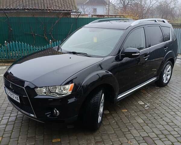 Черный Мицубиси Аутлендер, объемом двигателя 2.2 л и пробегом 225 тыс. км за 11500 $, фото 1 на Automoto.ua