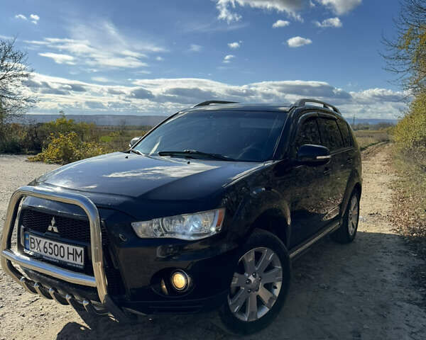 Чорний Міцубісі Аутлендер, об'ємом двигуна 2 л та пробігом 258 тис. км за 8699 $, фото 1 на Automoto.ua