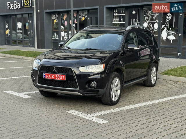 Черный Мицубиси Аутлендер, объемом двигателя 2.2 л и пробегом 225 тыс. км за 10950 $, фото 1 на Automoto.ua