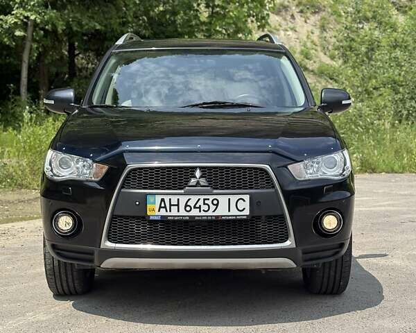 Черный Мицубиси Аутлендер, объемом двигателя 2.4 л и пробегом 275 тыс. км за 12000 $, фото 1 на Automoto.ua