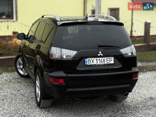 Черный Мицубиси Аутлендер, объемом двигателя 2.4 л и пробегом 184 тыс. км за 10800 $, фото 1 на Automoto.ua