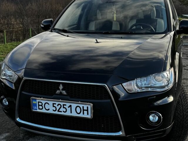 Черный Мицубиси Аутлендер, объемом двигателя 2.2 л и пробегом 249 тыс. км за 11500 $, фото 1 на Automoto.ua