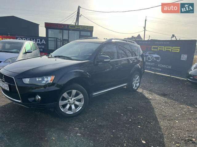 Черный Мицубиси Аутлендер, объемом двигателя 2.36 л и пробегом 244 тыс. км за 9850 $, фото 1 на Automoto.ua