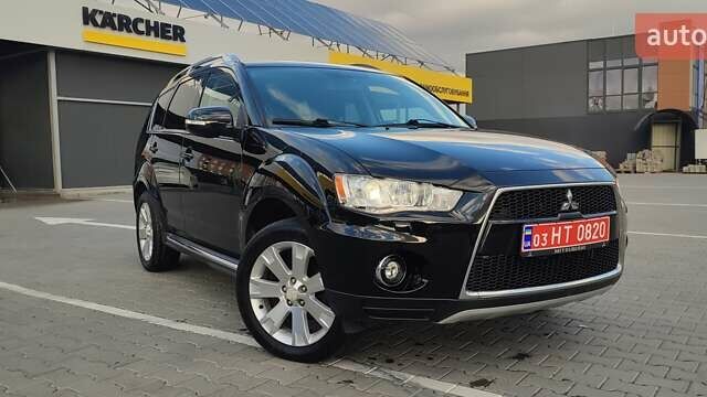 Черный Мицубиси Аутлендер, объемом двигателя 2 л и пробегом 210 тыс. км за 10600 $, фото 1 на Automoto.ua