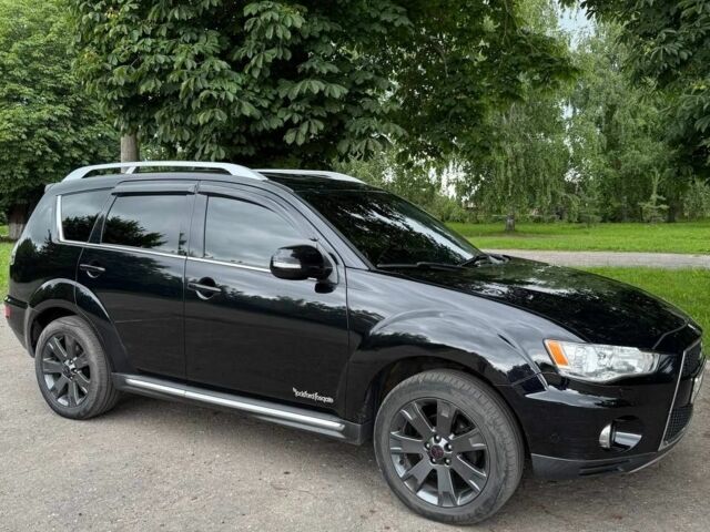 Чорний Міцубісі Аутлендер, об'ємом двигуна 2 л та пробігом 210 тис. км за 10700 $, фото 1 на Automoto.ua