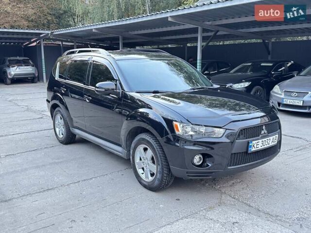 Черный Мицубиси Аутлендер, объемом двигателя 2 л и пробегом 150 тыс. км за 10200 $, фото 1 на Automoto.ua