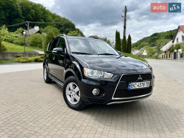 Черный Мицубиси Аутлендер, объемом двигателя 2 л и пробегом 234 тыс. км за 9900 $, фото 1 на Automoto.ua