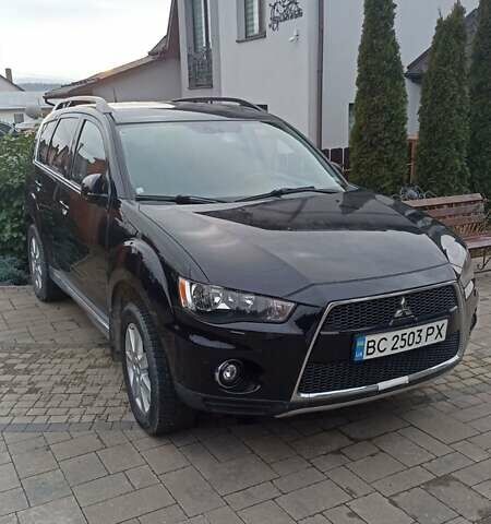 Черный Мицубиси Аутлендер, объемом двигателя 2 л и пробегом 196 тыс. км за 9900 $, фото 1 на Automoto.ua