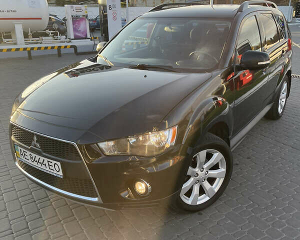 Чорний Міцубісі Аутлендер, об'ємом двигуна 2.4 л та пробігом 93 тис. км за 12500 $, фото 1 на Automoto.ua