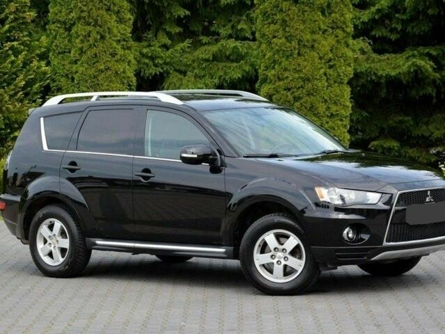 Черный Мицубиси Аутлендер, объемом двигателя 2.3 л и пробегом 186 тыс. км за 11150 $, фото 1 на Automoto.ua