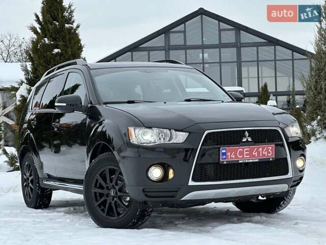 Черный Мицубиси Аутлендер, объемом двигателя 2.3 л и пробегом 189 тыс. км за 10999 $, фото 1 на Automoto.ua