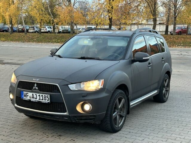 Чорний Міцубісі Аутлендер, об'ємом двигуна 2 л та пробігом 250 тис. км за 4450 $, фото 1 на Automoto.ua