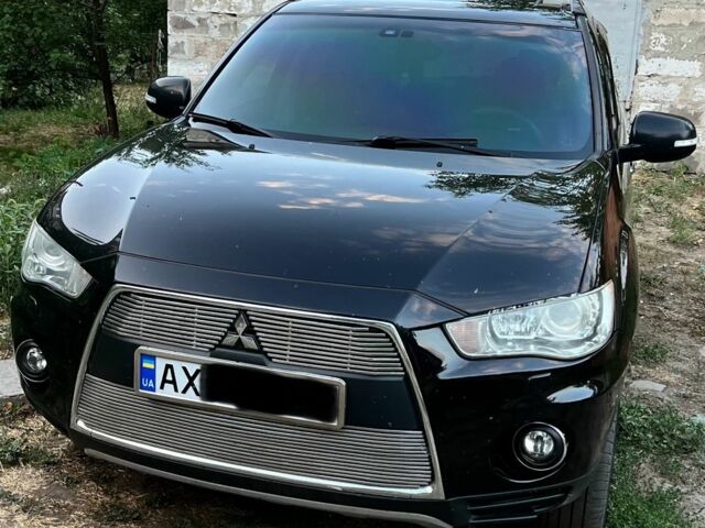 Черный Мицубиси Аутлендер, объемом двигателя 2.4 л и пробегом 220 тыс. км за 10500 $, фото 1 на Automoto.ua