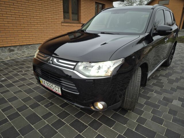 Черный Мицубиси Аутлендер, объемом двигателя 2.4 л и пробегом 211 тыс. км за 12590 $, фото 1 на Automoto.ua