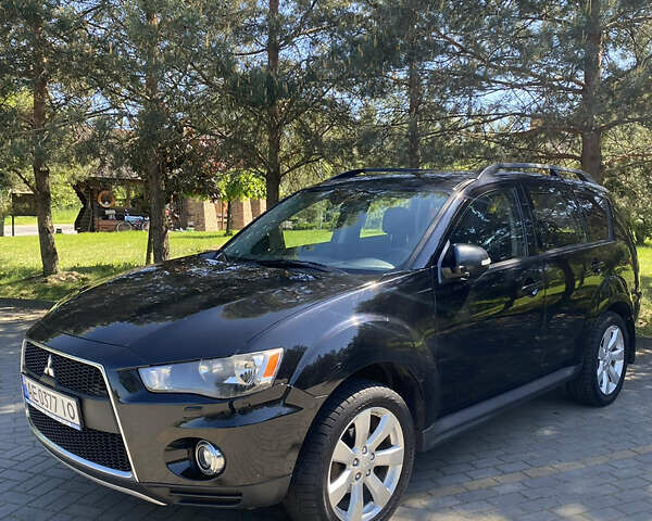 Черный Мицубиси Аутлендер, объемом двигателя 2.36 л и пробегом 155 тыс. км за 9000 $, фото 1 на Automoto.ua