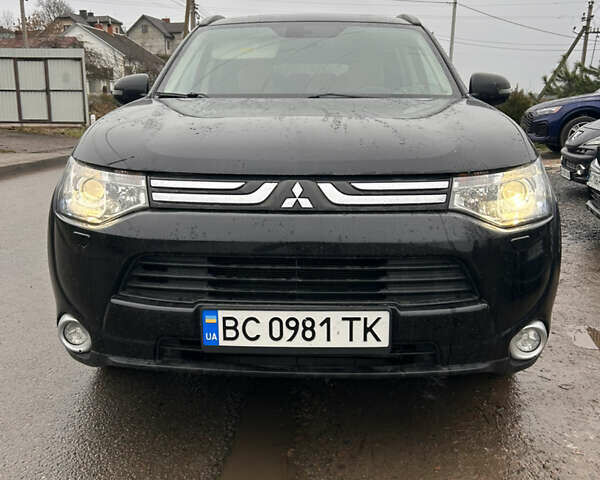 Черный Мицубиси Аутлендер, объемом двигателя 2.27 л и пробегом 202 тыс. км за 13100 $, фото 1 на Automoto.ua