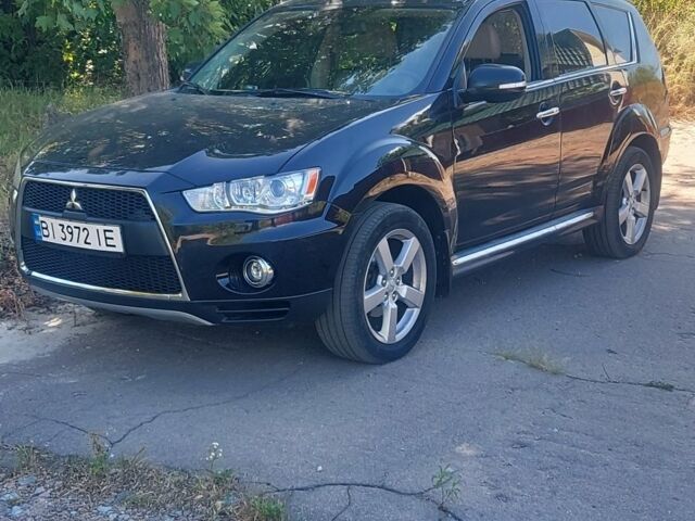 Черный Мицубиси Аутлендер, объемом двигателя 2.4 л и пробегом 134 тыс. км за 12499 $, фото 1 на Automoto.ua