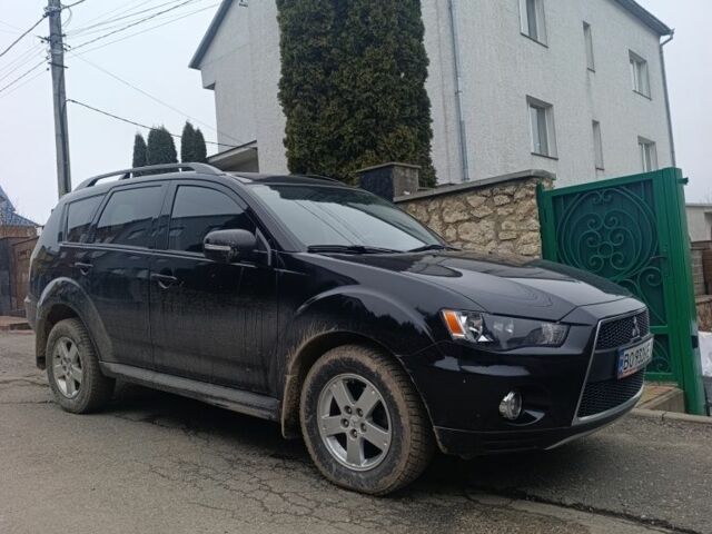 Черный Мицубиси Аутлендер, объемом двигателя 2 л и пробегом 235 тыс. км за 10300 $, фото 1 на Automoto.ua