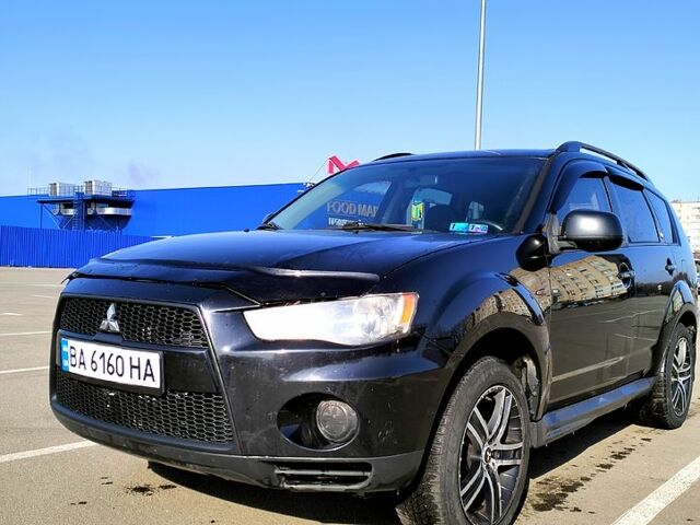 Черный Мицубиси Аутлендер, объемом двигателя 2.4 л и пробегом 140 тыс. км за 10500 $, фото 1 на Automoto.ua