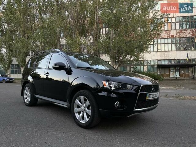 Черный Мицубиси Аутлендер, объемом двигателя 2.36 л и пробегом 160 тыс. км за 11900 $, фото 1 на Automoto.ua