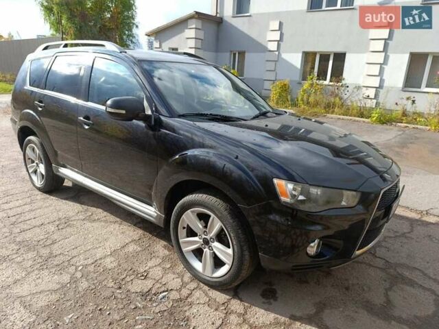 Черный Мицубиси Аутлендер, объемом двигателя 2.2 л и пробегом 218 тыс. км за 11800 $, фото 1 на Automoto.ua