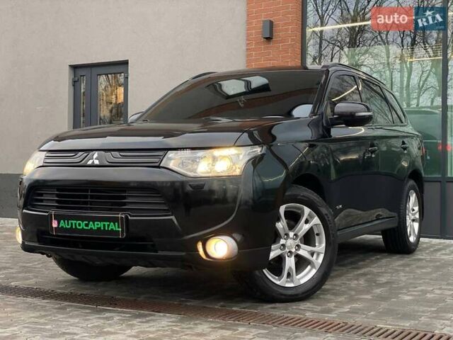 Черный Мицубиси Аутлендер, объемом двигателя 2.36 л и пробегом 212 тыс. км за 12990 $, фото 1 на Automoto.ua
