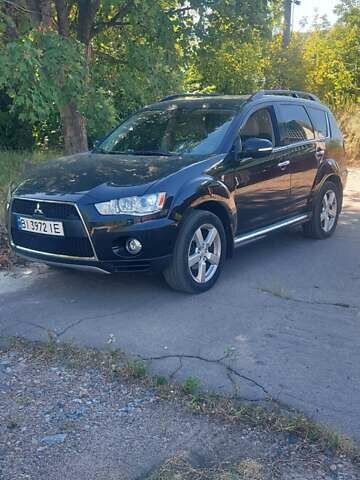 Чорний Міцубісі Аутлендер, об'ємом двигуна 2.4 л та пробігом 135 тис. км за 12399 $, фото 1 на Automoto.ua