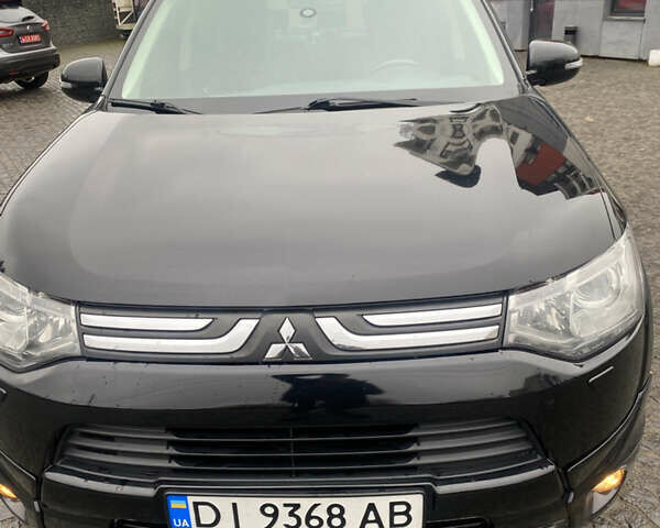Черный Мицубиси Аутлендер, объемом двигателя 2.27 л и пробегом 280 тыс. км за 11808 $, фото 1 на Automoto.ua