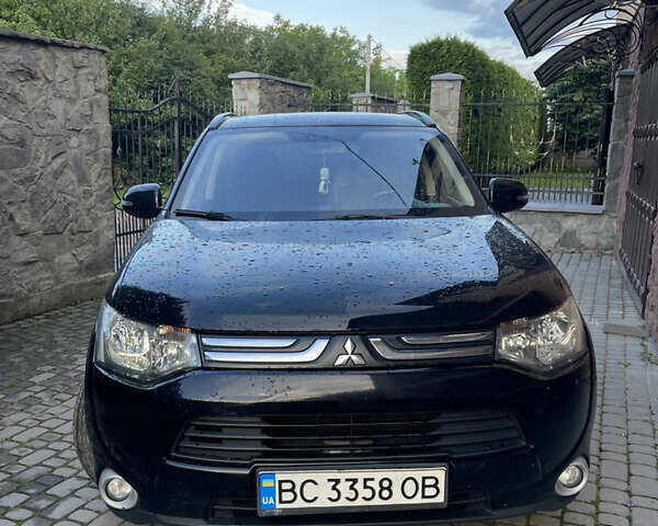Черный Мицубиси Аутлендер, объемом двигателя 2 л и пробегом 270 тыс. км за 11799 $, фото 1 на Automoto.ua