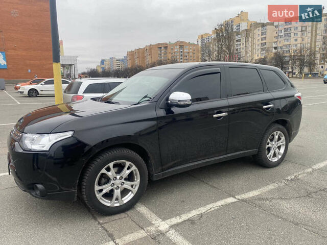 Черный Мицубиси Аутлендер, объемом двигателя 2.4 л и пробегом 150 тыс. км за 13700 $, фото 1 на Automoto.ua
