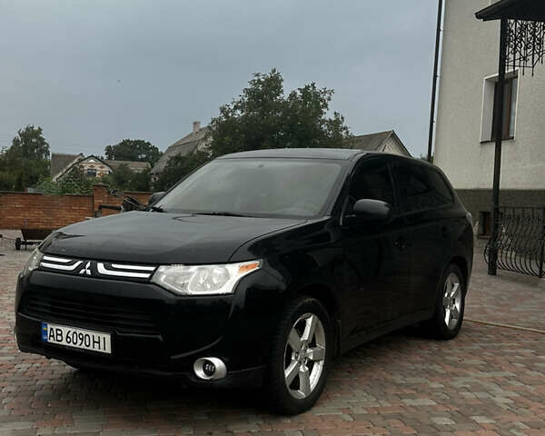 Черный Мицубиси Аутлендер, объемом двигателя 2.36 л и пробегом 70 тыс. км за 9000 $, фото 1 на Automoto.ua