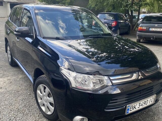 Черный Мицубиси Аутлендер, объемом двигателя 2 л и пробегом 168 тыс. км за 12007 $, фото 1 на Automoto.ua