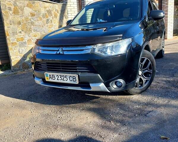 Черный Мицубиси Аутлендер, объемом двигателя 2.4 л и пробегом 183 тыс. км за 15000 $, фото 1 на Automoto.ua