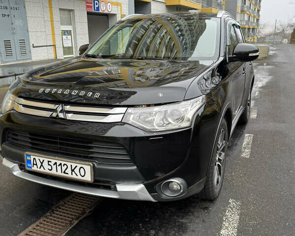 Черный Мицубиси Аутлендер, объемом двигателя 2.27 л и пробегом 244 тыс. км за 14000 $, фото 1 на Automoto.ua