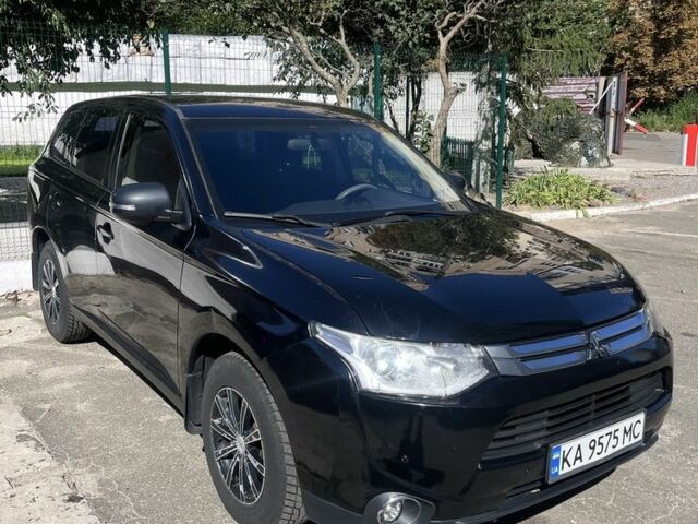 Черный Мицубиси Аутлендер, объемом двигателя 2 л и пробегом 150 тыс. км за 12000 $, фото 1 на Automoto.ua
