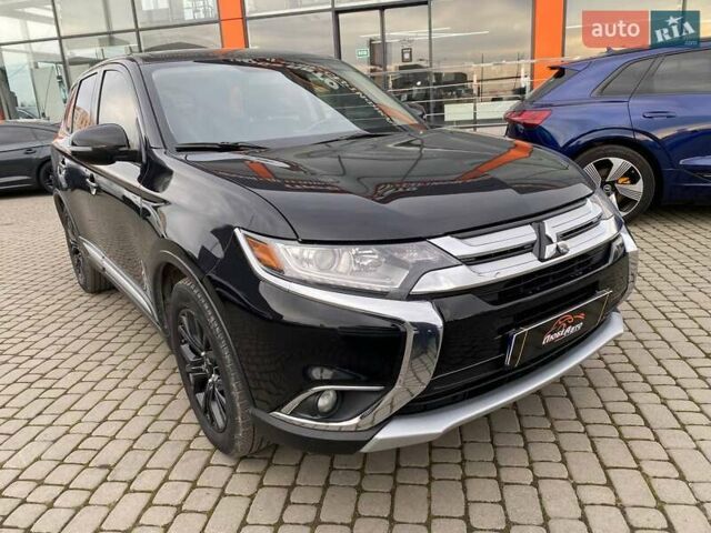 Черный Мицубиси Аутлендер, объемом двигателя 2.36 л и пробегом 143 тыс. км за 12900 $, фото 1 на Automoto.ua