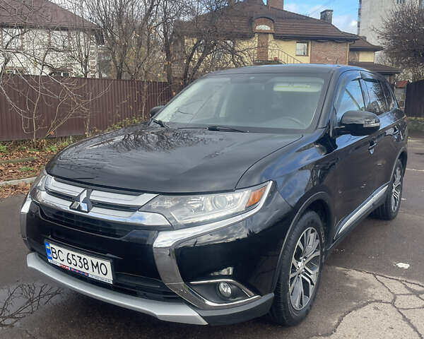 Чорний Міцубісі Аутлендер, об'ємом двигуна 2.36 л та пробігом 121 тис. км за 14700 $, фото 1 на Automoto.ua