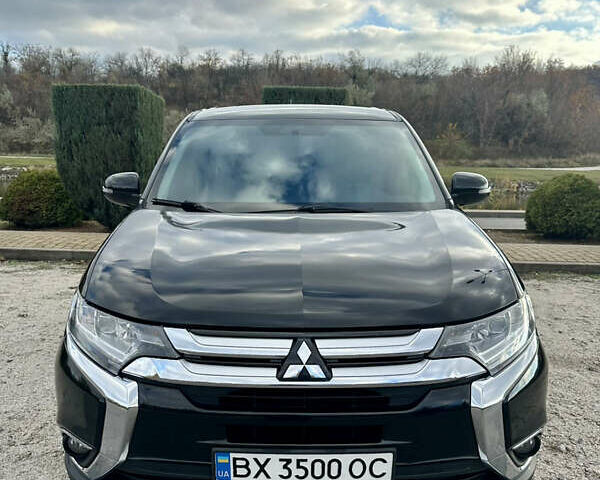 Черный Мицубиси Аутлендер, объемом двигателя 2.36 л и пробегом 119 тыс. км за 15600 $, фото 1 на Automoto.ua